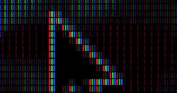 Image of a pixelated close-up of a computer screen shows a large black cursor arrow among red, green, and blue subpixels.